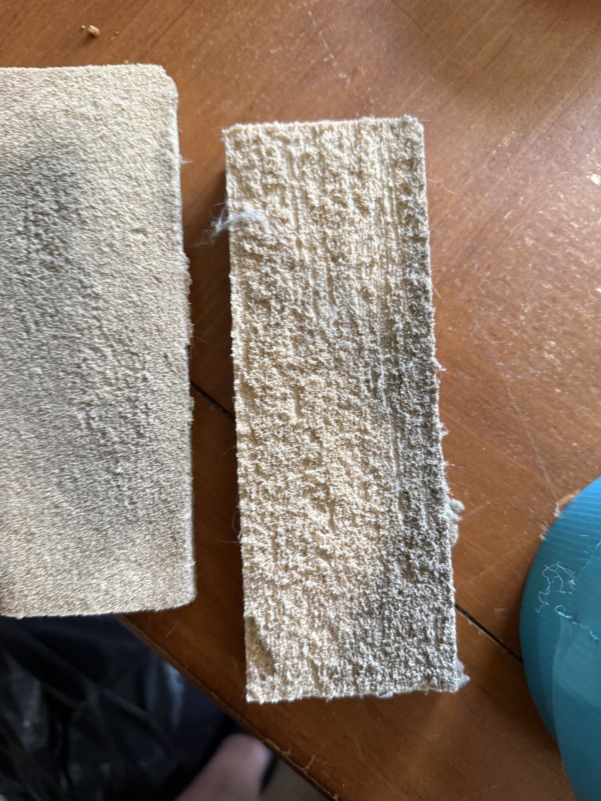 New chemical sponge next to one used on a single wall section, gray with soot - Camarillo, CA