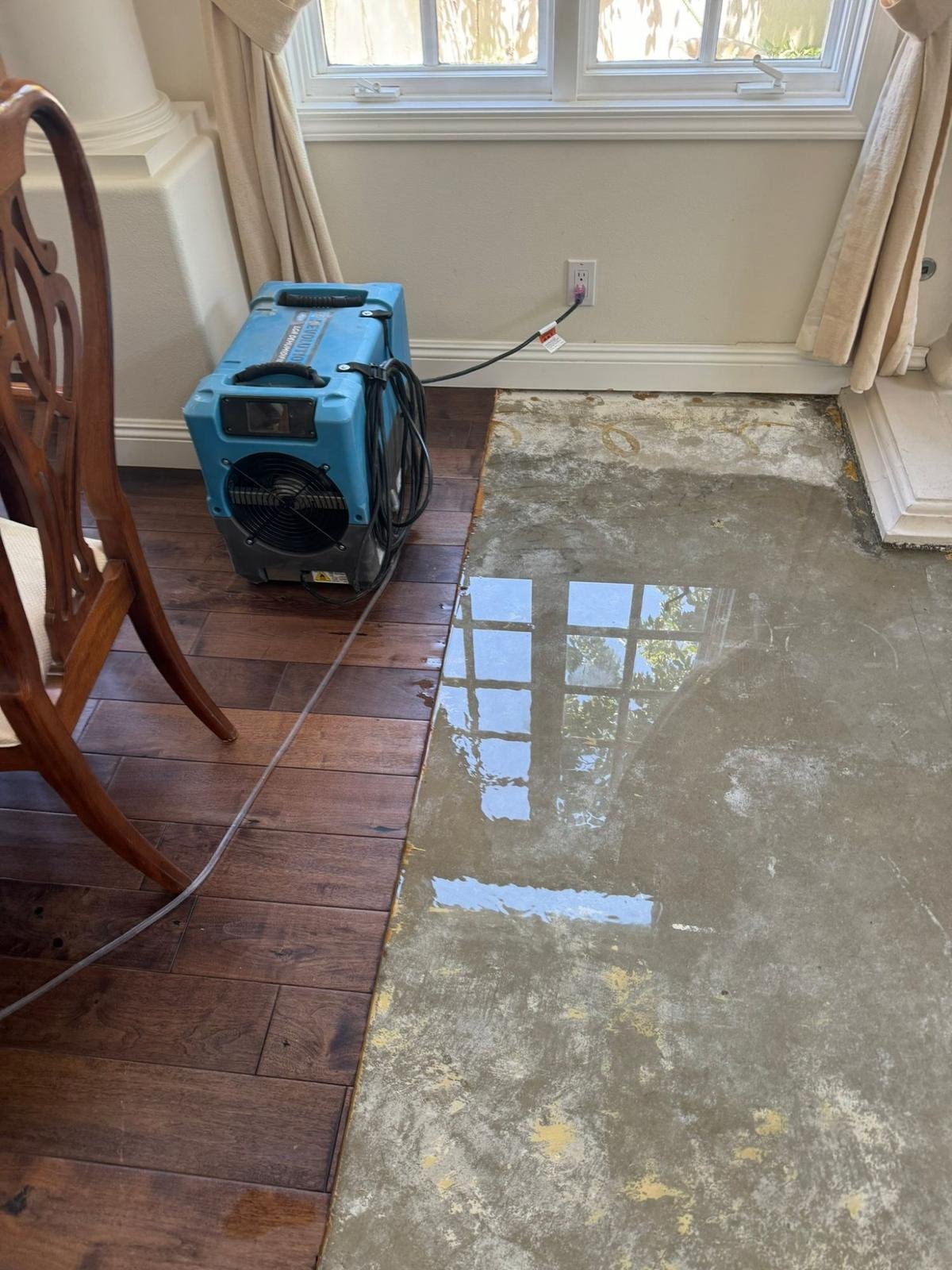 Commercial LGR dehumidifier running during structural drying after water damage in a Calabasas, CA home — Instant Restoration.