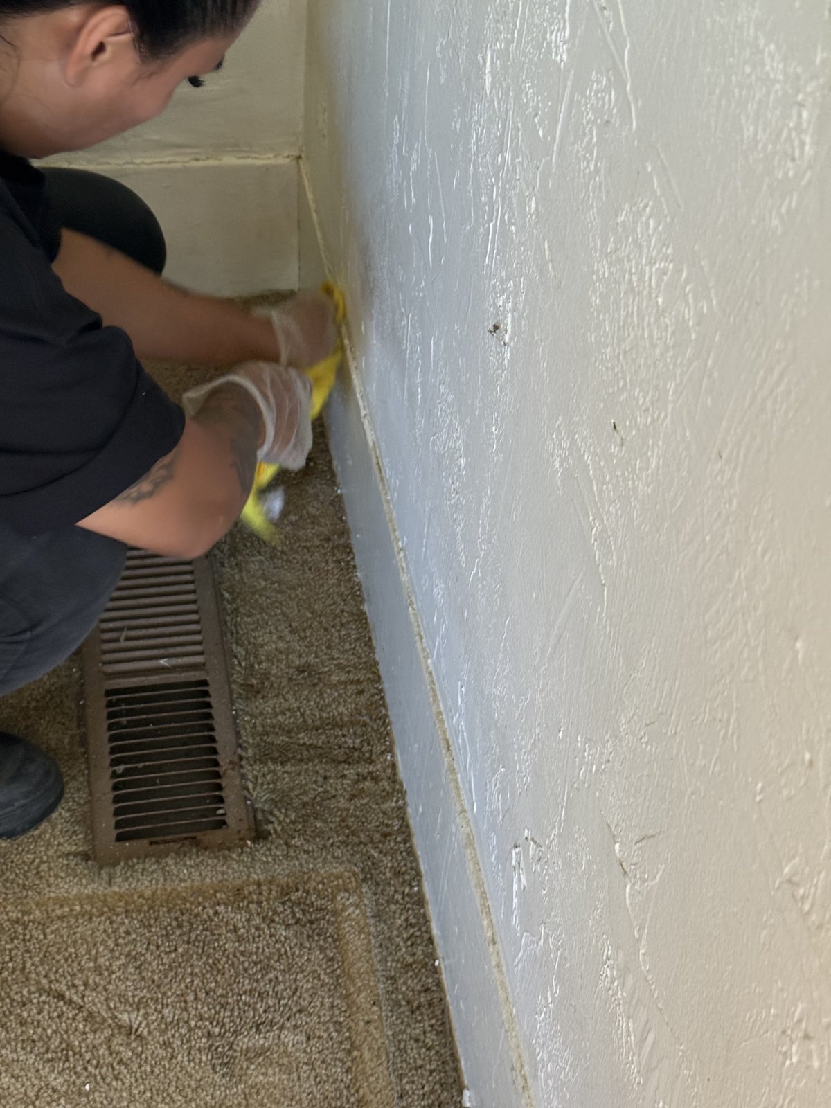 Cleaning soot from a wall beside a floor HVAC vent - ductwork recirculates smoke odor - Camarillo, CA