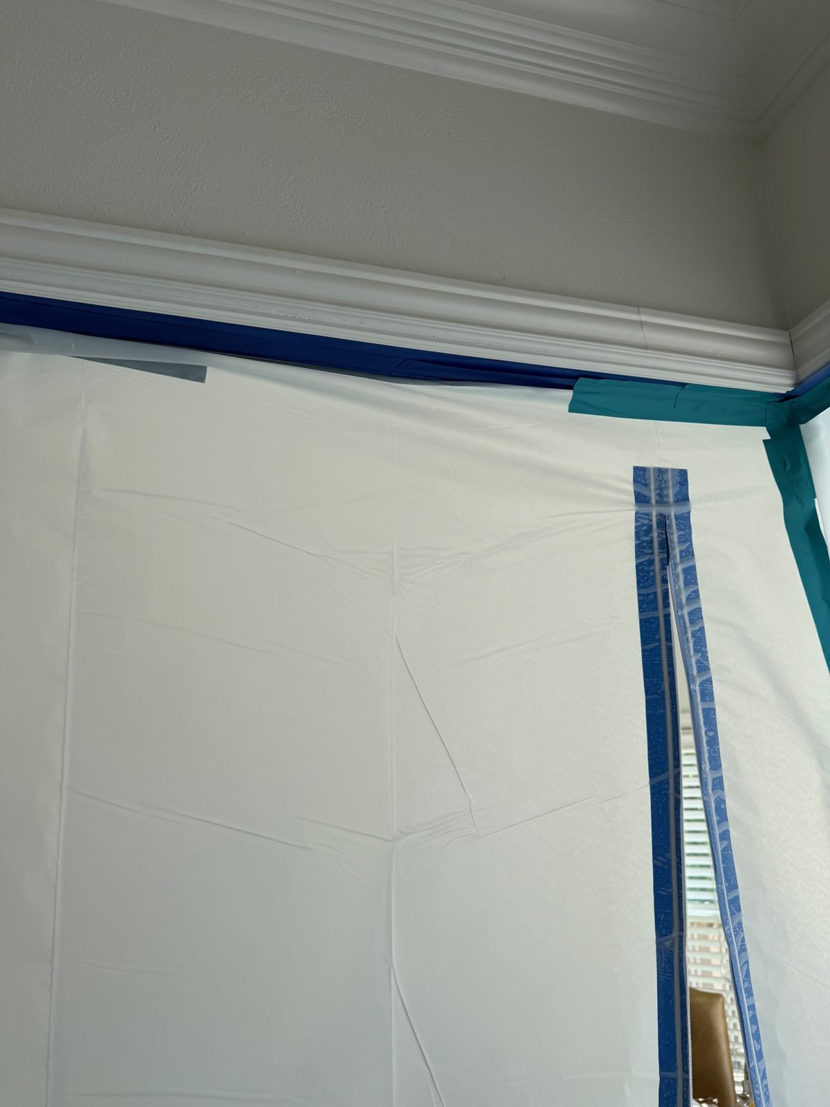 Instant Restoration job photo in Westlake Village, CA: White poly containment with zipper door sealed at crown molding