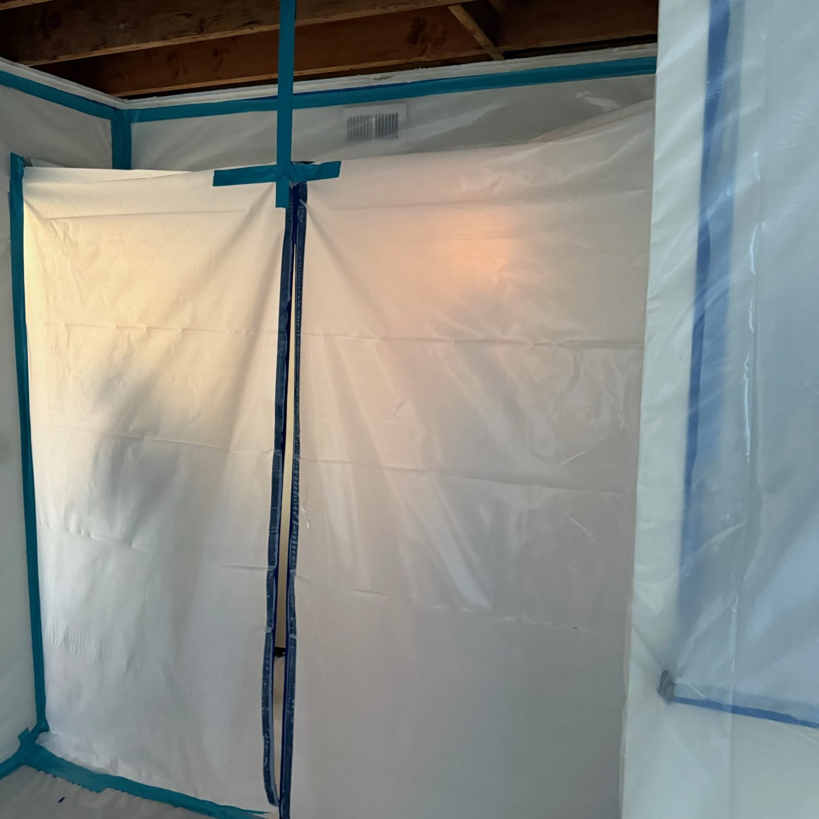 Instant Restoration job photo in Arcadia, CA: Poly containment barrier with zipper door and teal tape